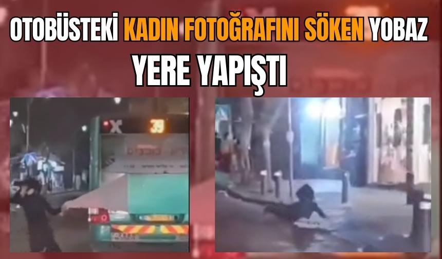 Otobüsteki kadın fotoğrafına saldıran yobaz yere yapıştı