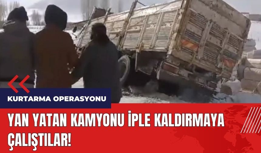 Yan yatan kamyonu iple kaldırmaya çalıştılar