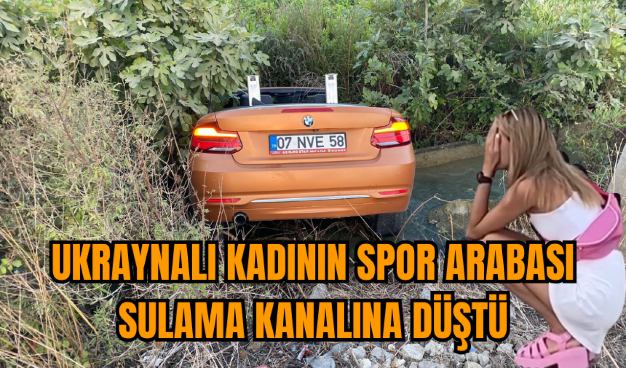 Ukraynalı kadının spor arabası sulama kanalına düştü