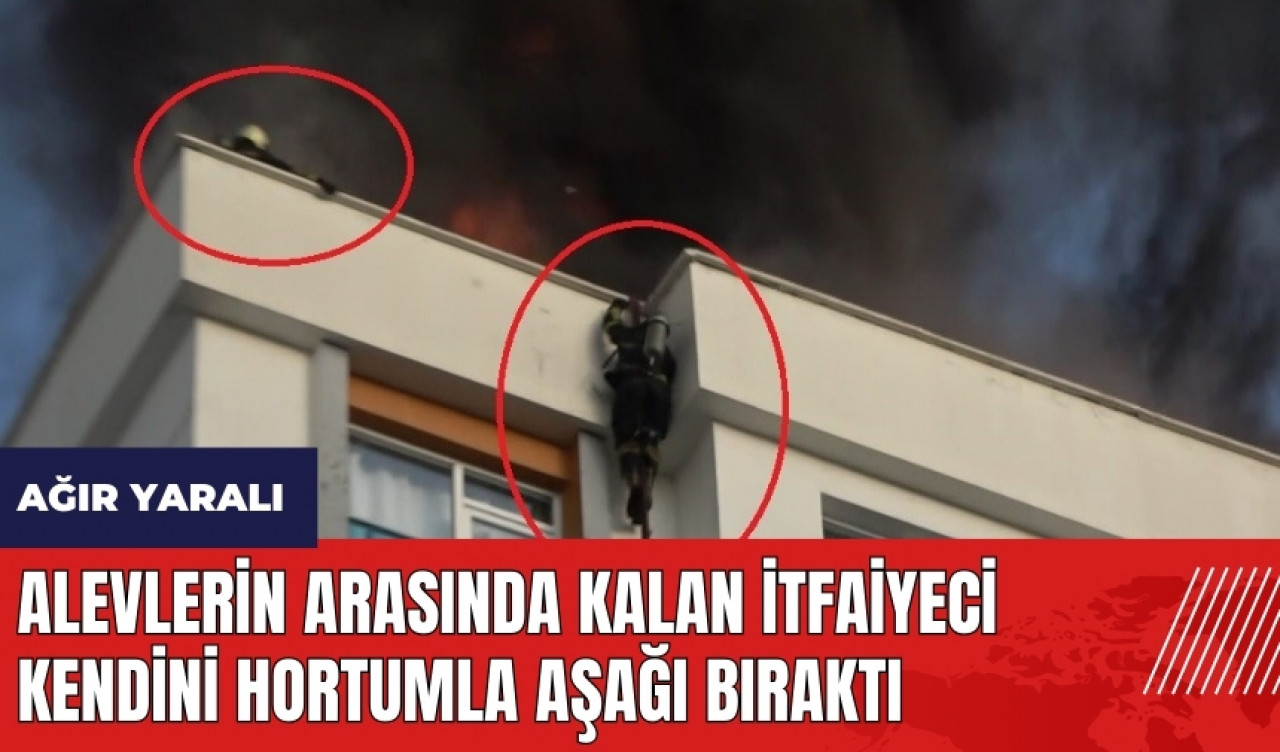 Alevlerin arasında kalan itfaiyeci kendini hortumla aşağı bıraktı