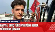 Hataylı genç Türk bayrağını hurda yığınının içinden çıkardı