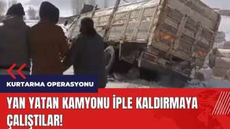 Yan yatan kamyonu iple kaldırmaya çalıştılar