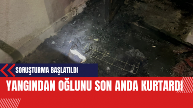 Yangından oğlunu son anda kurtardı