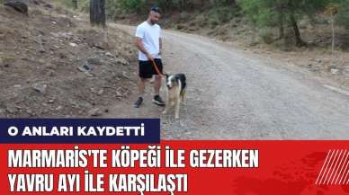 Marmaris'te köpeği ile gezerken yavru ayı ile karşılaştı